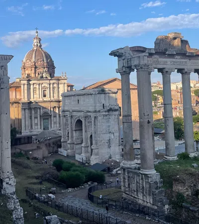 a large stone structure with pillars in front of a building
