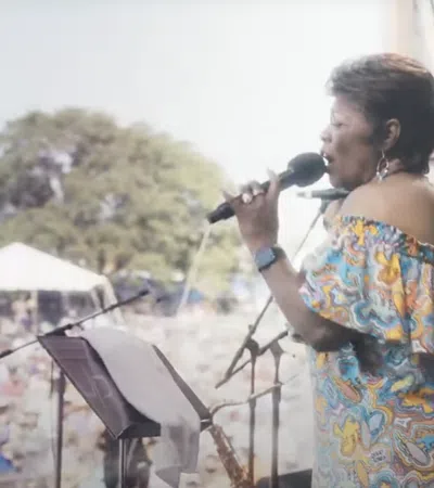 a person singing into a microphone