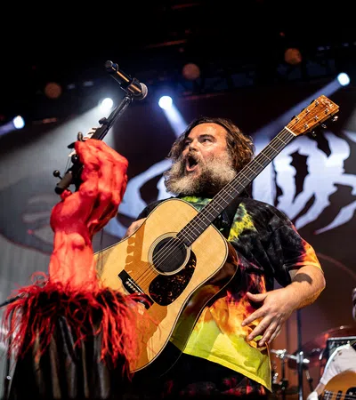Jack Black playing a guitar