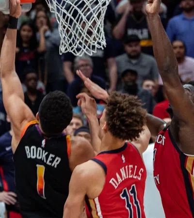 a group of men playing basketball