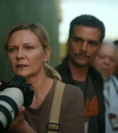 Kirsten Dunst holding a camera
