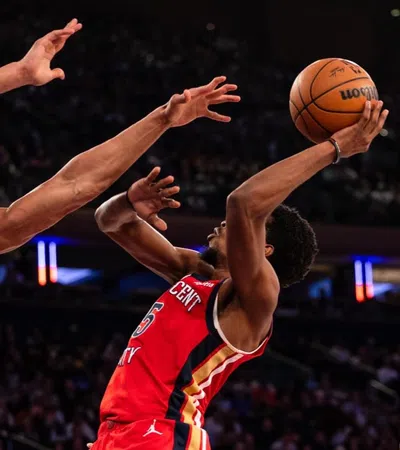 a basketball player jumping to make a shot