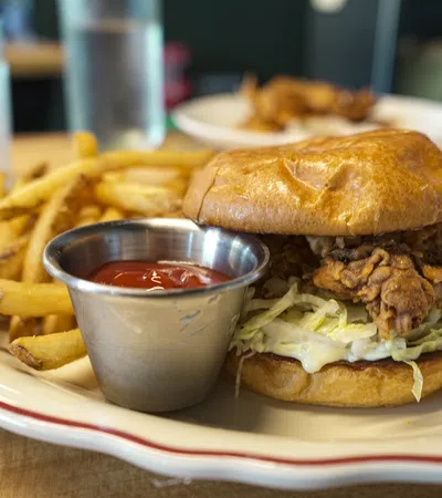 a burger and fries on a plate