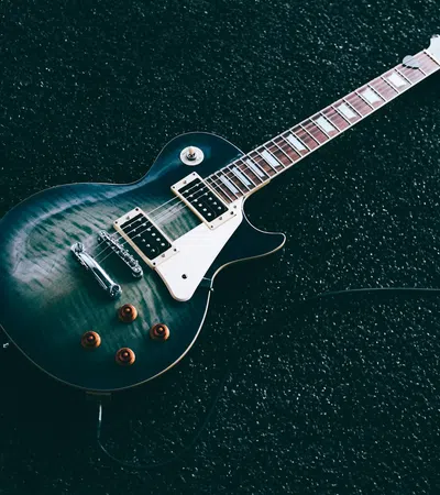 a guitar on a black surface