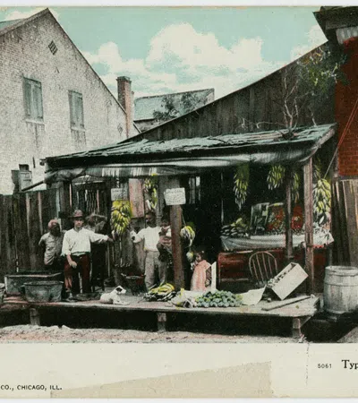 Vintage Italian fruit stand in New Orleans with vendors and fresh produce under wooden shelter.