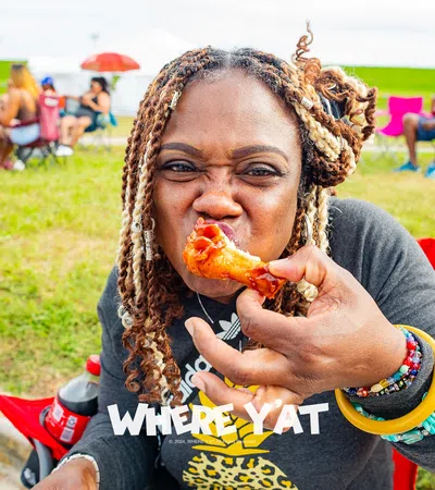 a person eating a slice of pizza
