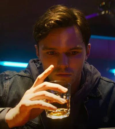 a man holding a glass