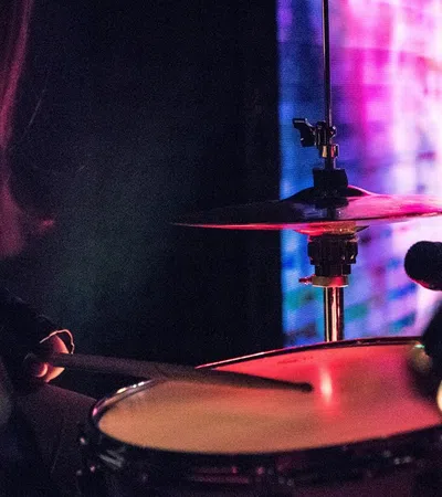 a person playing a drum set