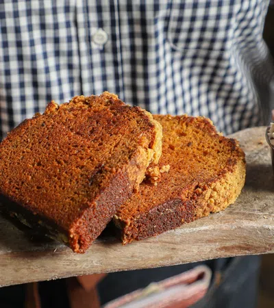 a person holding a loaf of bread