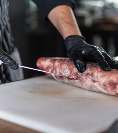 a person cutting a fish