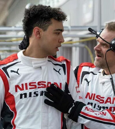 two men wearing racing uniforms