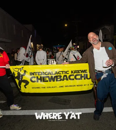 a group of people marching with a banner