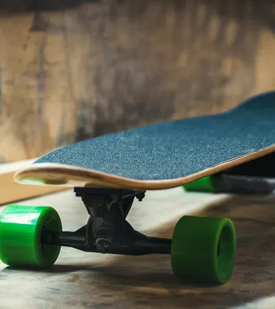 a couple of skateboards on a wood surface