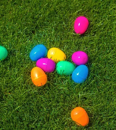 a group of colorful eggs on grass
