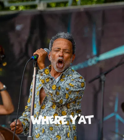 John Boutté singing into a microphone