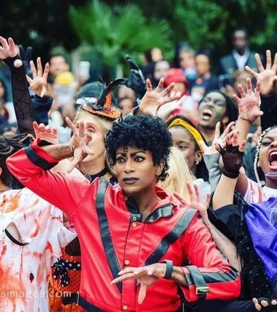 a group of people with their hands up