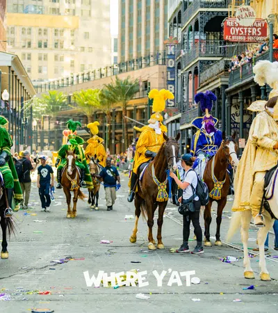 a group of people riding horses in a parade