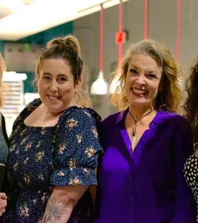 a group of women smiling