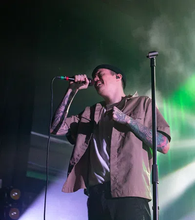 a person singing into a microphone