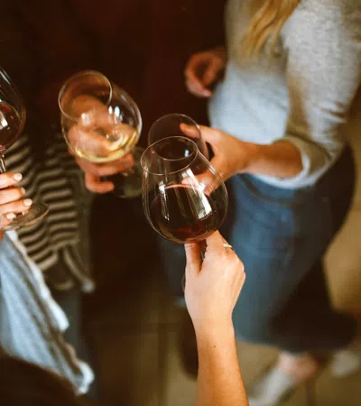 a group of people holding wine glasses