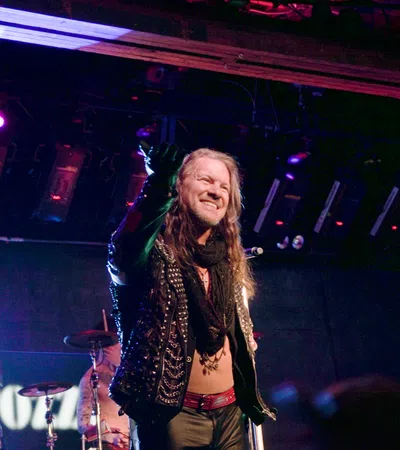 Chris Jericho with long hair on stage