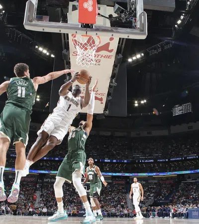 a basketball player jumping to dunk a basketball