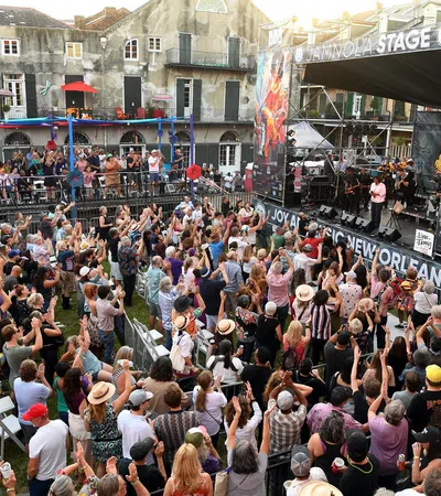 a crowd of people watching a band on stage