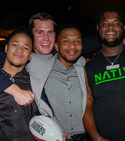 a group of men posing for a picture