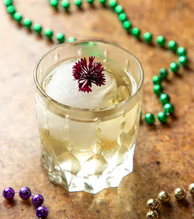 a glass of milk and a necklace