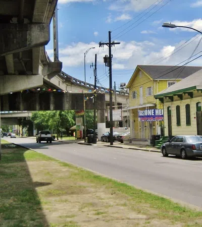 a street with cars and buildings