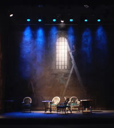 a stage with chairs and tables