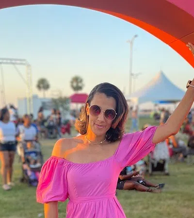 a man in a pink dress