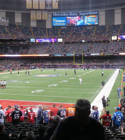 a football stadium with a crowd watching