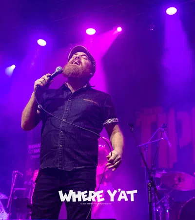 a person singing into a microphone
