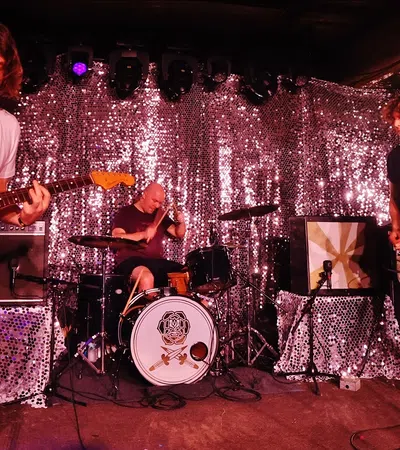 a group of people playing instruments on a stage
