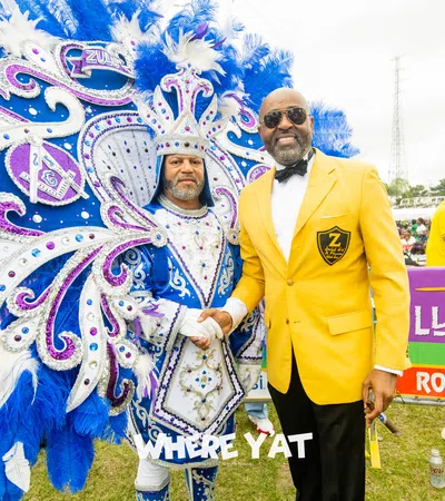 a man standing next to a man in a garment