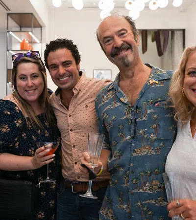 a group of people holding wine glasses