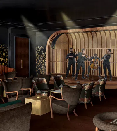 Cozy jazz club interior with wood panel stage, velvet seating, floral accents, and dim ambient lighting.