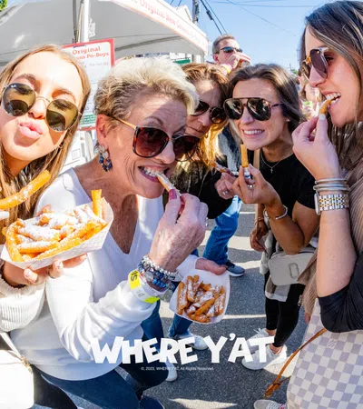 a group of women eating pizza