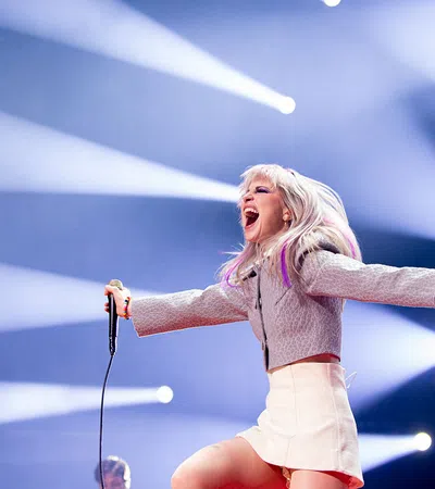 a woman singing into a microphone