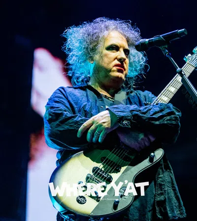 Robert Smith playing a guitar