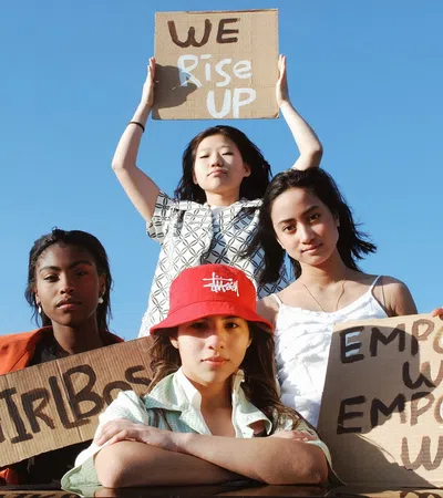 a group of women holding signs
