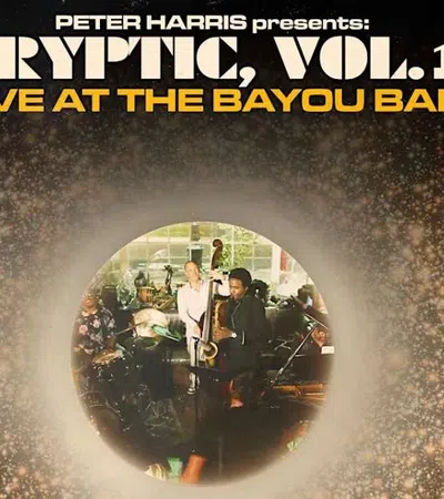 Live jazz performance at Bayou Bar with musicians playing double bass, drums, and piano in a vibrant atmosphere.