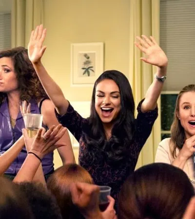 a group of women raising their hands