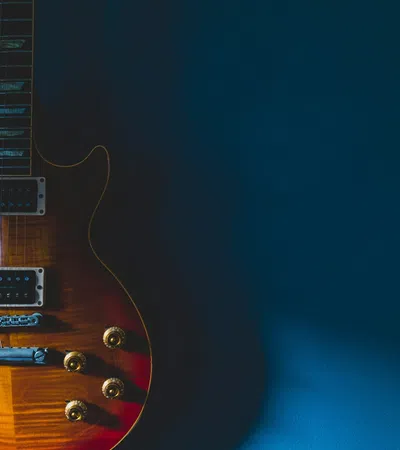 a guitar with a blue background