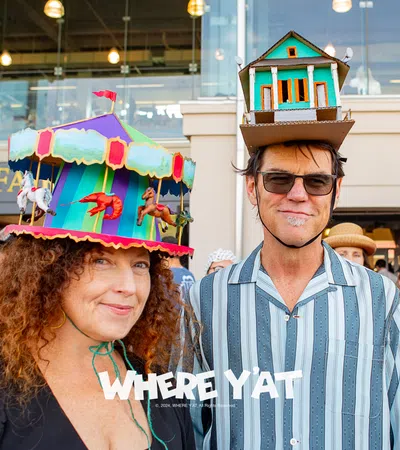 a man and woman wearing hats