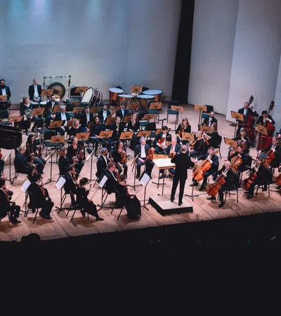 a group of people playing instruments on a stage