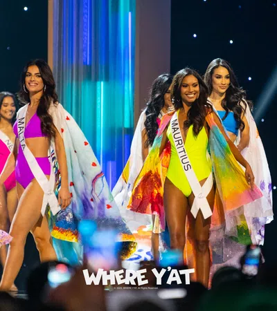a group of women in colorful dresses