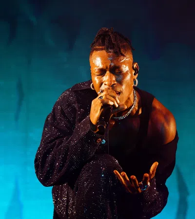 a man singing into a microphone