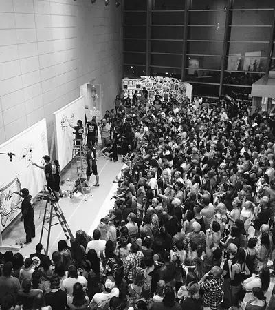 a large crowd of people in a room